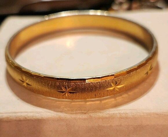 Monet Jewelry - Vintage Monet Gold Tone Bangle Bracelet With Starburst Design